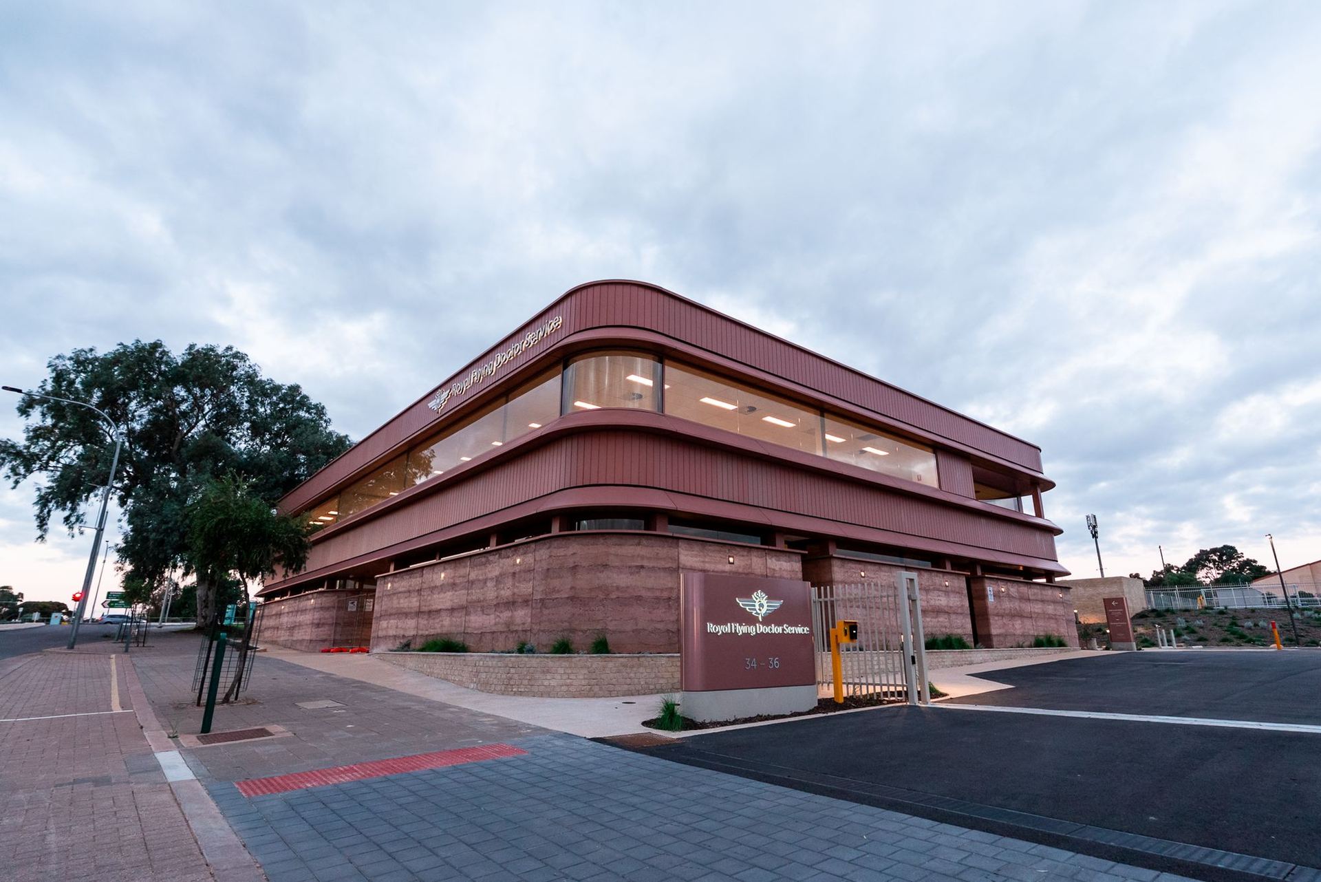 RFDS Port Augusta building from street level, with the entry sign and paved forecourt