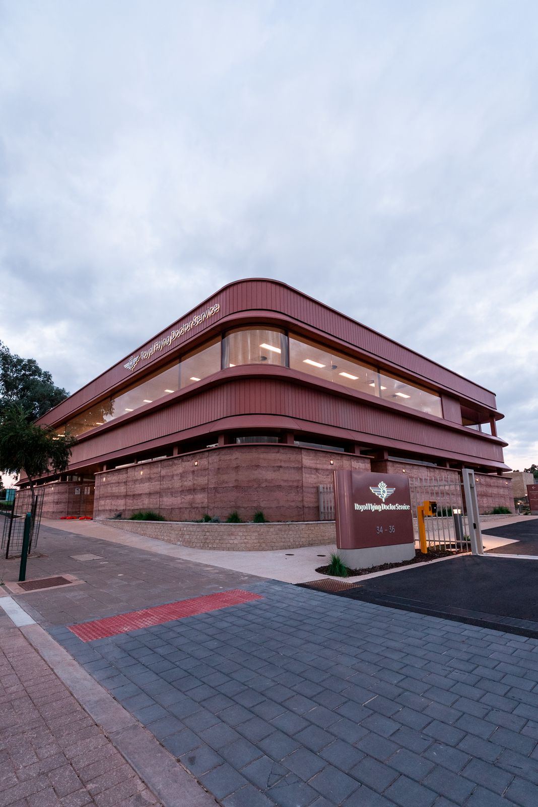 Corner of the RFDS Port Augusta building with signage and paving